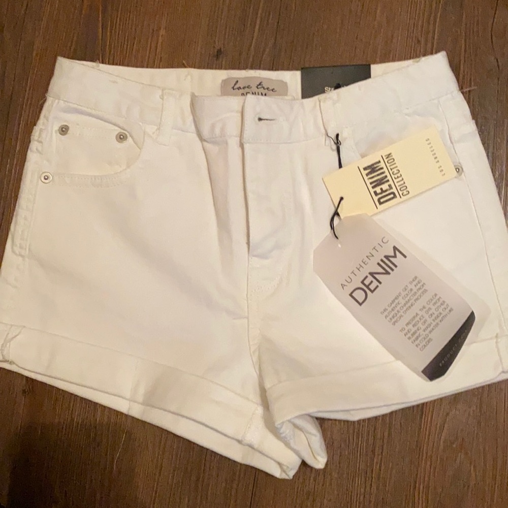 Premium Denimwear cuffed white shorts.